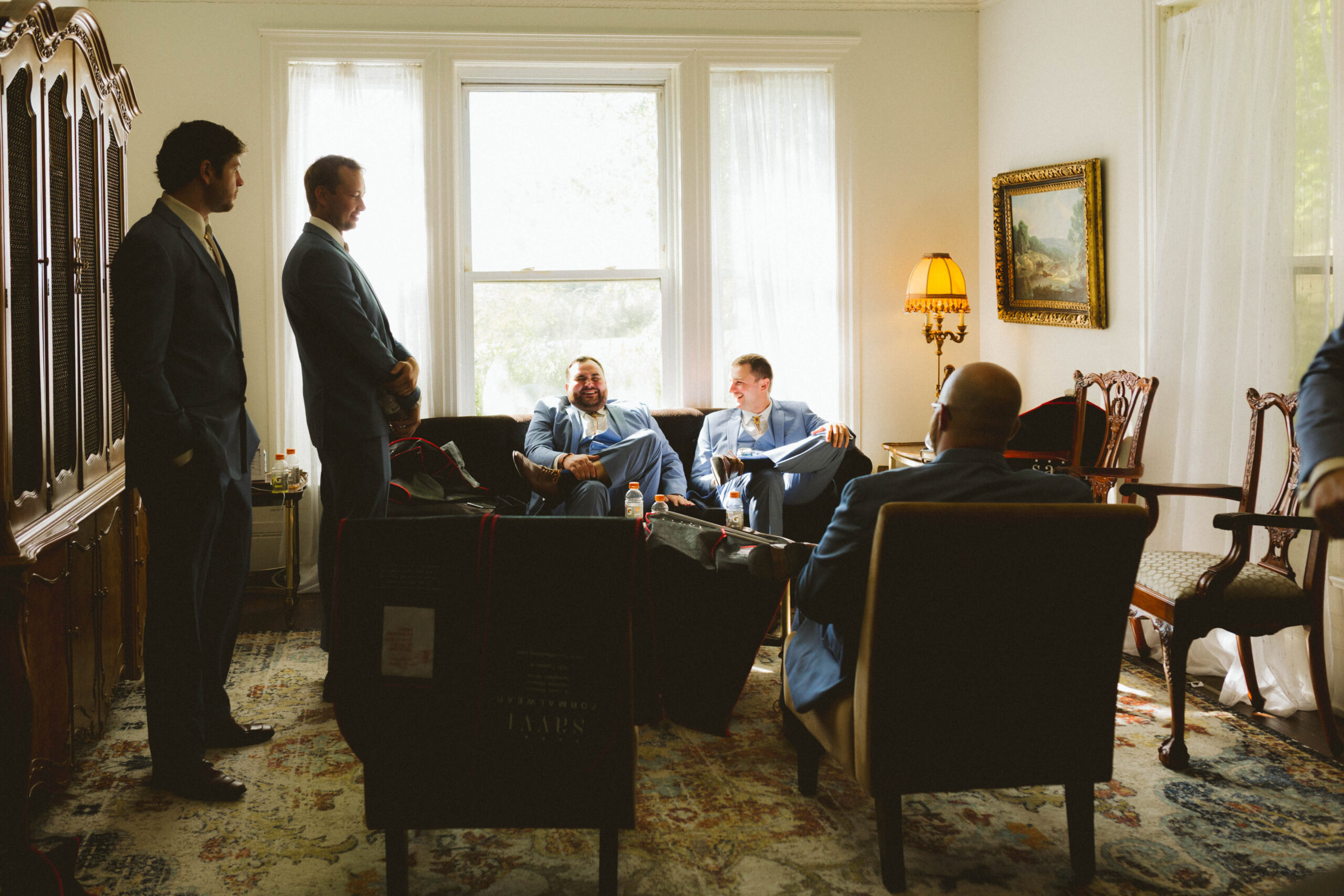 groomsmen wait while getting ready at historic bell hill in illinois