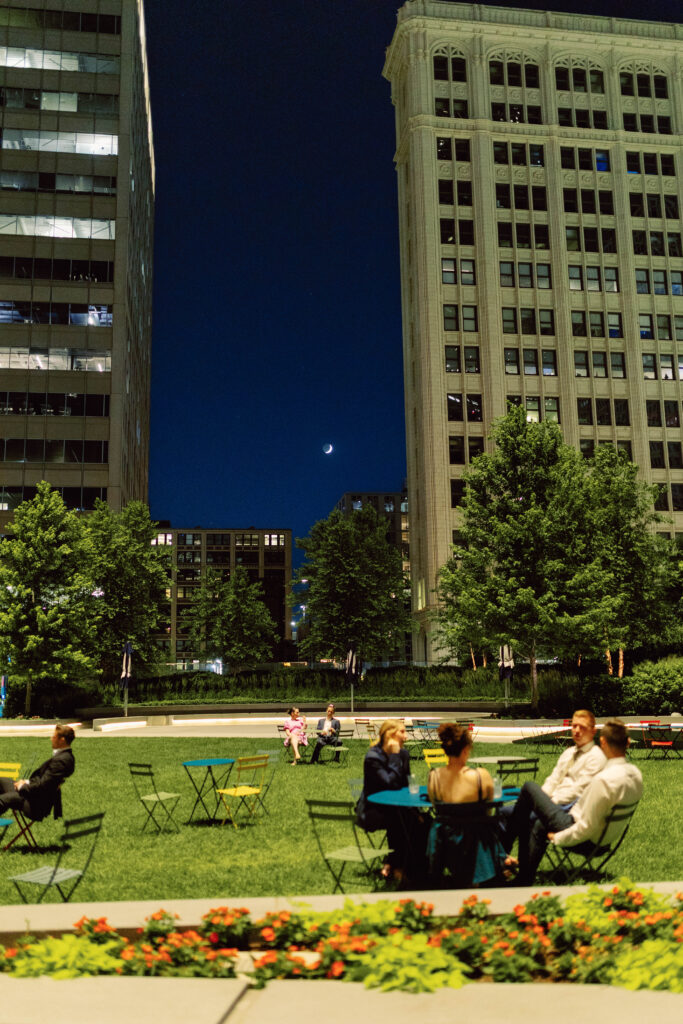 dark blue dusk sky, guests taking a break during reception at canal street eatery