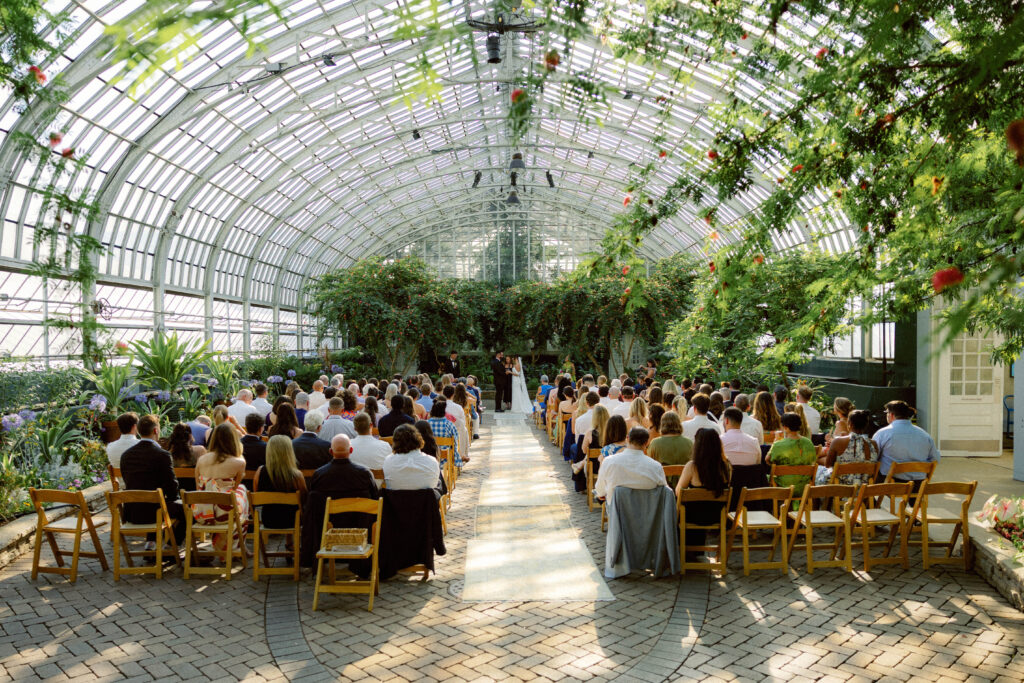 wide angle shot of ceremony space at garfield park conservatory in chicago during loose-editorial ceremony