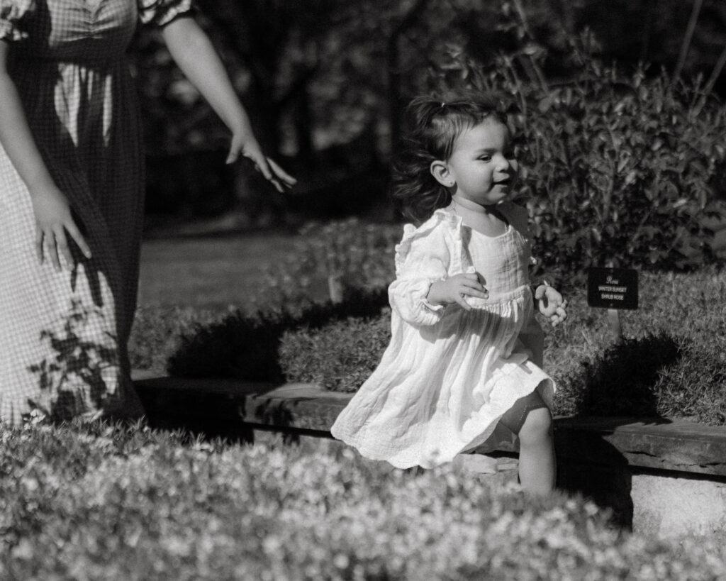 Candid family moment with children running in the yard | luxury documentary family photography Columbia MO