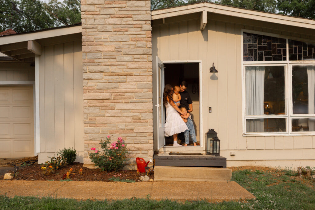 Timeless luxury documentary family photography Columbia MO with parents snuggling their kids
