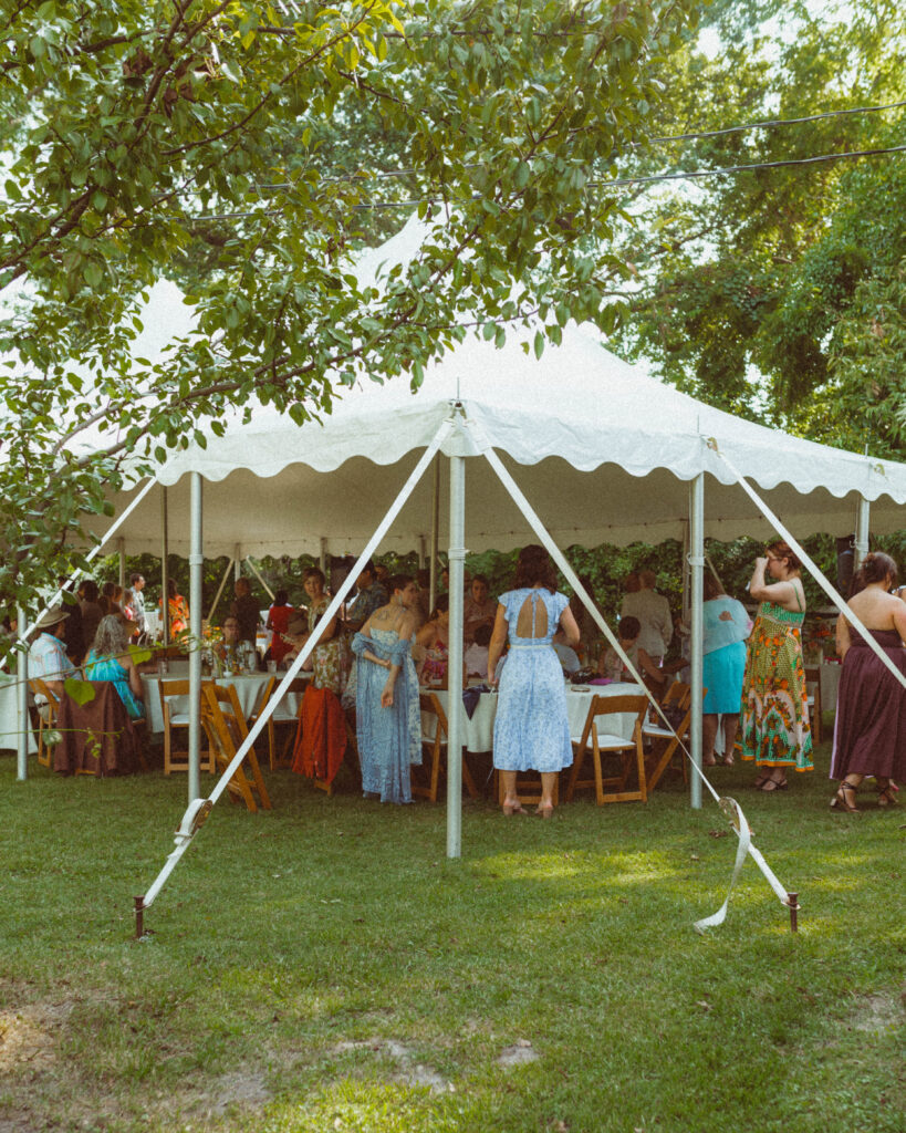 Wide shot of backyard ceremony with tent
High-end backyard wedding in Missouri under a refined tent setup, curated for artful and intimate celebrations.