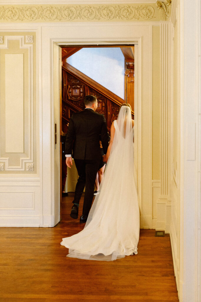 just married couple walking down the aisle smiling – loose editorial wedding photography with candid documentary style