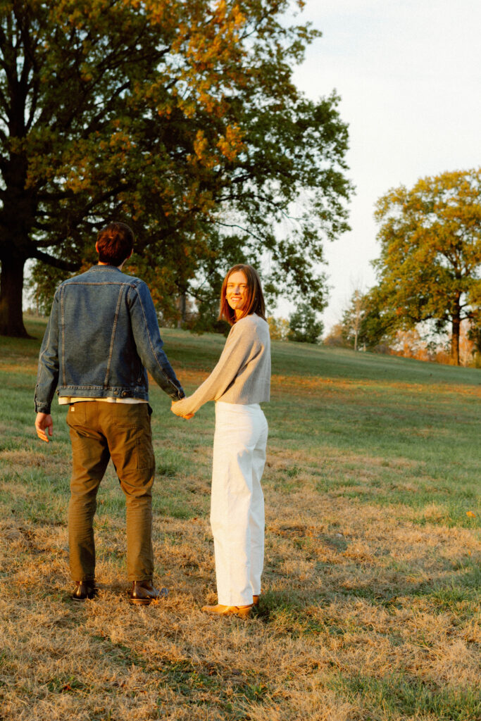 Couple photography in Columbia Missouri at Stephens Lake Park during autumn with colorful leaves