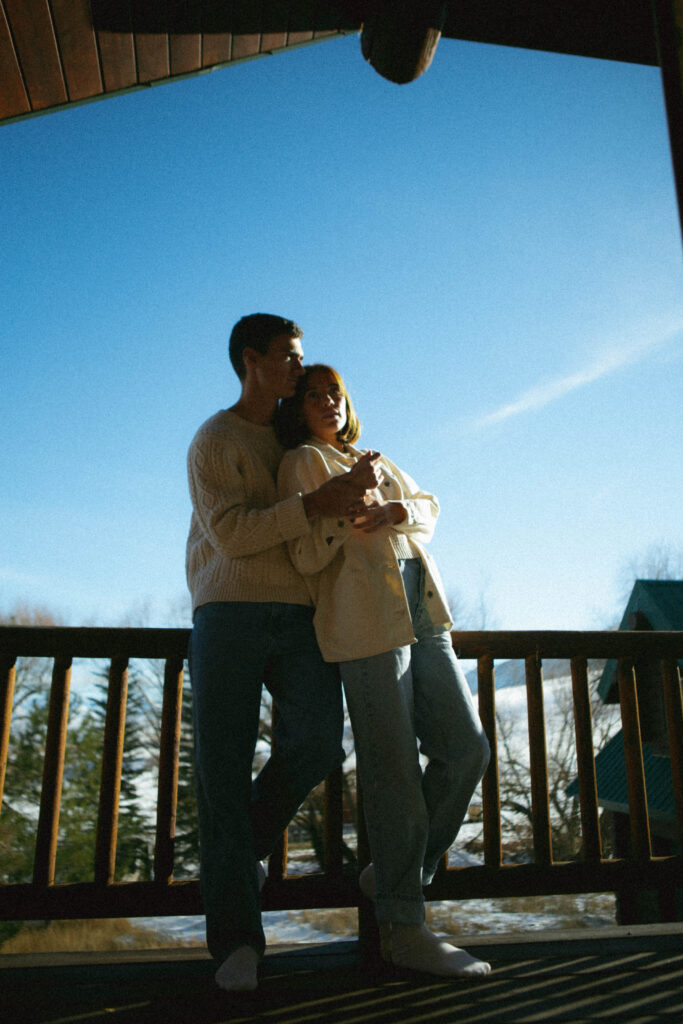 Utah editorial engagement photography of a couple embracing in a wintery mountain landscape