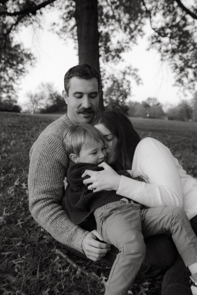 Family photo session at Stephens Lake Park Columbia MO with oak trees and open fields
