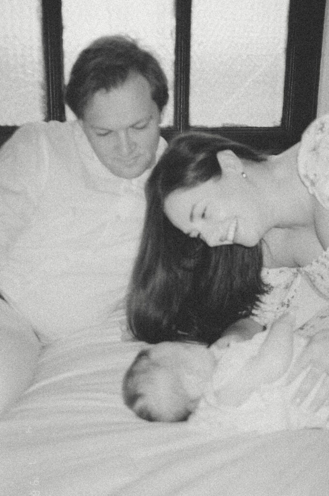 Editorial newborn photography in Kansas City capturing tender family moments on 35mm film