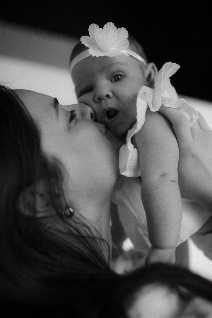 Documentary newborn photography in Kansas City capturing tiny hands and a 3-month-old’s expressions