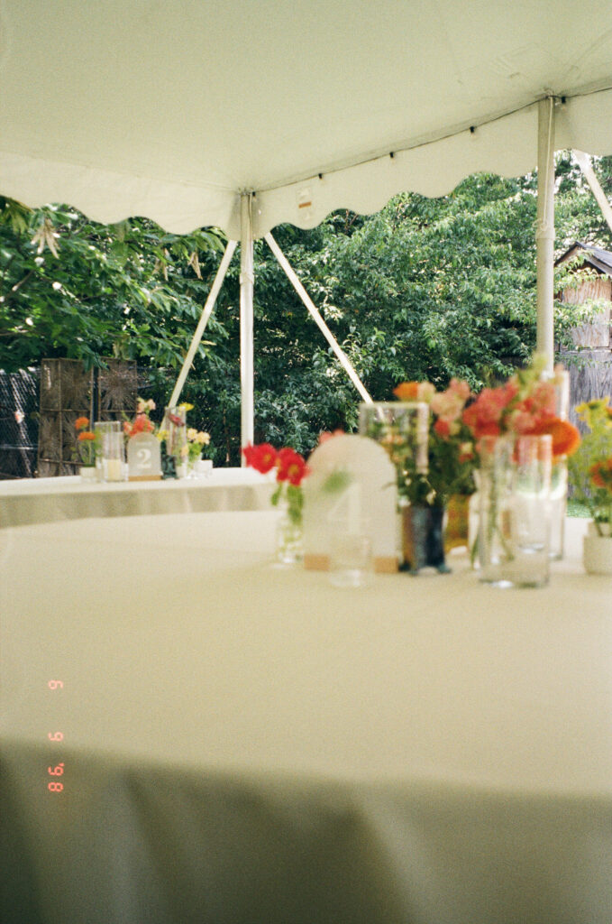 Family celebrating at backyard dinner
High-end backyard wedding dinner in Missouri with artful table setup and meaningful moments shared among family and friends.